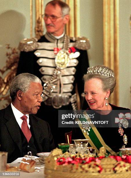 File picture taken on March 15, 1999 shows Denmark's Queen Margrethe speaking with South-African President Nelson Mandela during in Copenhagen. The...