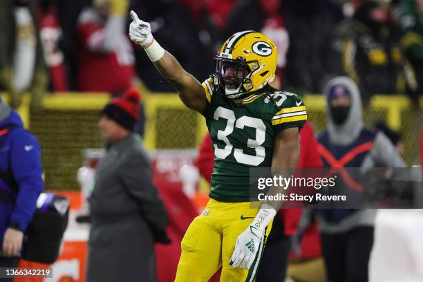 Running back Aaron Jones of the Green Bay Packers signals after a first down during the 1st quarter of the NFC Divisional Playoff game against the...