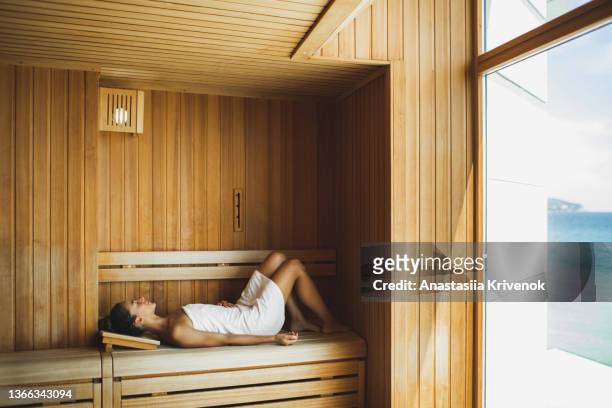 Young beautiful slim woman relaxing in spa.