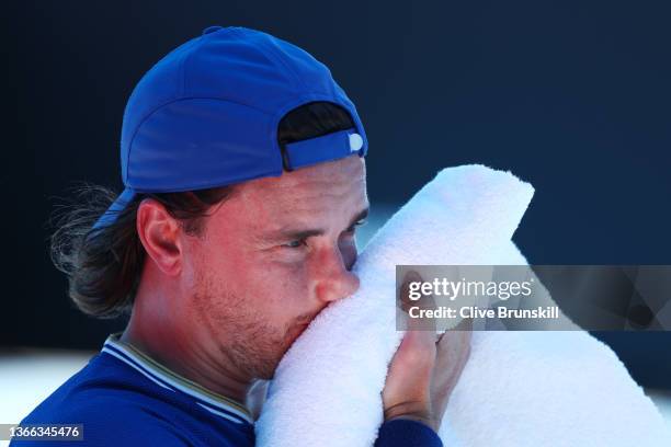 Gordon Reid of Great Britain cools down in his quarterfinals singles match against Stephane Houdet of France during day seven of the 2022 Australian...