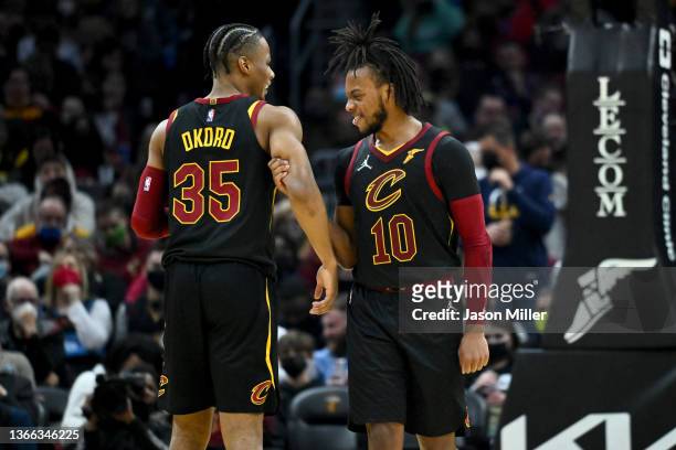 Isaac Okoro and Darius Garland of the Cleveland Cavaliers celebrate after Okoro scored during the second quarter against the Oklahoma City Thunder at...