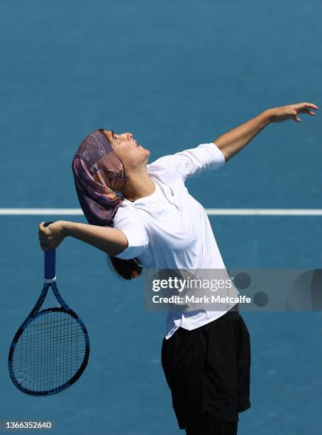 Meshkatolzahra Safi of Iran serves in her round one junior girls singles match against Anja Nayar of Australia during day seven of the 2022...