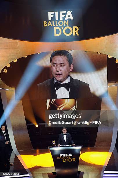 Norio Sasaki of Japan receives his trophy after winning the FIFA World Coach of the Year for Women's Football award at the FIFA Ballon d'Or Gala 2011...