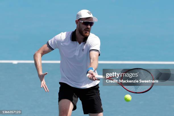 Jamie Murray of Great Britain plays a forehand in his third round doubles match against Simone Bolelli of Italy and Fabio Fognini of Italy during day...