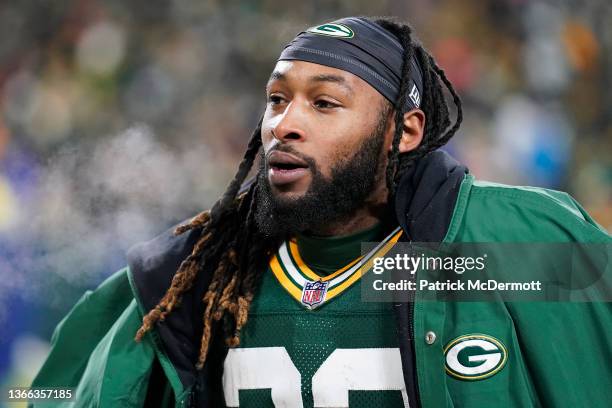 Running back Aaron Jones of the Green Bay Packers watches from the sidelines during the 4th quarter of the NFC Divisional Playoff game against the...