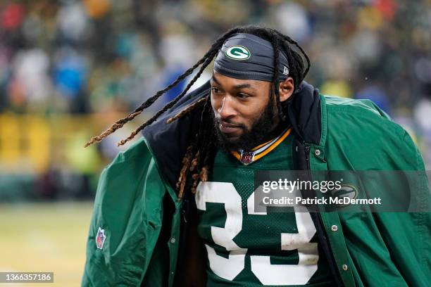 Running back Aaron Jones of the Green Bay Packers watches from the sidelines during the 4th quarter of the NFC Divisional Playoff game against the...