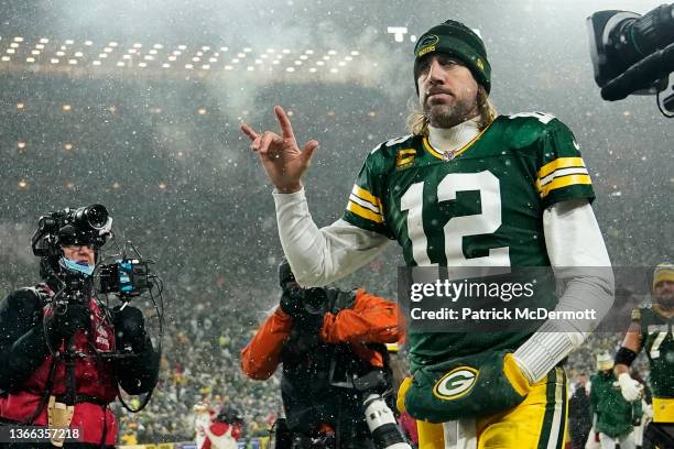 Quarterback Aaron Rodgers of the Green Bay Packers gestures as he exits the field after losing the NFC Divisional Playoff game to the San Francisco...