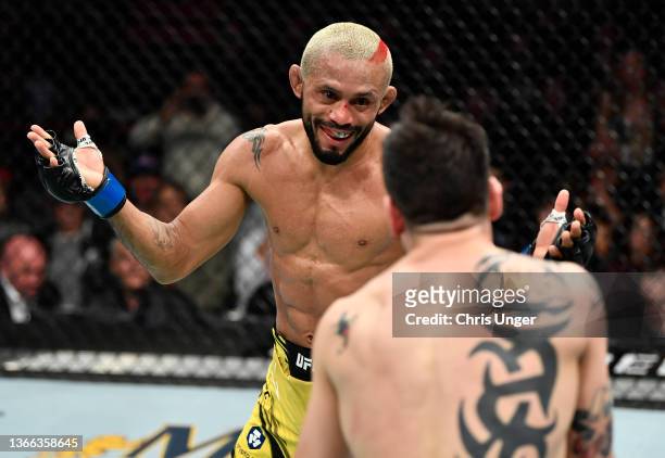 Deiveson Figueiredo of Brazil battles Brandon Moreno of Mexico in their UFC flyweight championship fight during the UFC 270 event at Honda Center on...