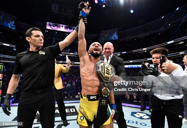 Deiveson Figueiredo of Brazil reacts after his decision victory over Brandon Moreno of Mexico in their UFC flyweight championship fight during the...