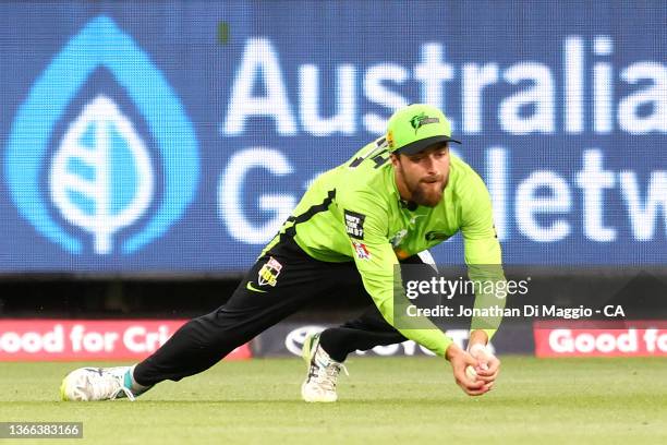 Alex Ross of the Thunder makes a catch during the Men's Big Bash League match between the Sydney Thunder and the Adelaide Strikers at Melbourne...