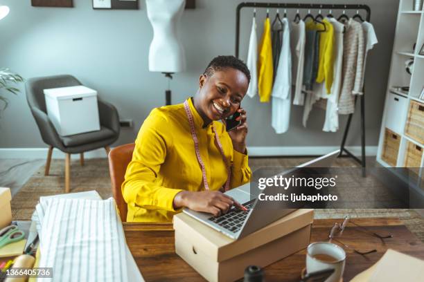 small business owener - african on phone stockfoto's en -beelden