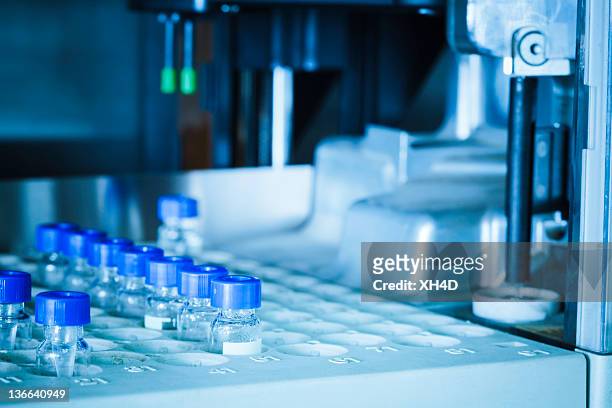 laboratory equipment working - drug manufacturing stock pictures, royalty-free photos & images