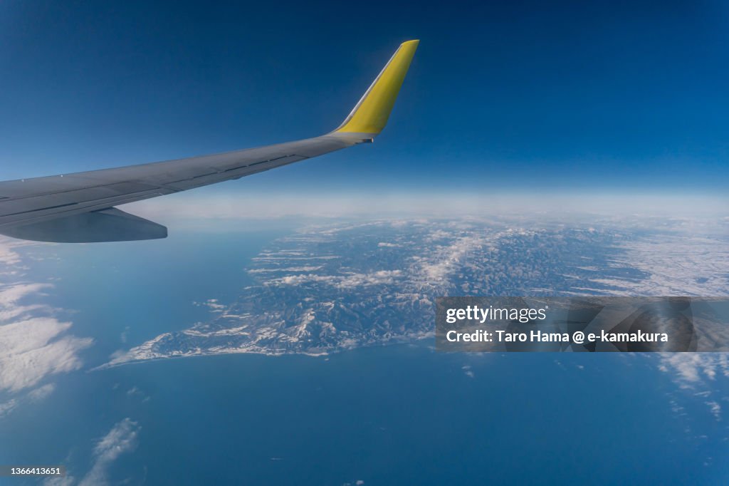 The airplane flying over Hokkaido of Japan aerial view from airplane