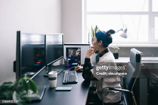 computer programmer working on new software - designer female stock pictures, royalty-free photos & images