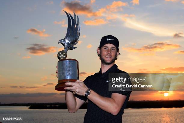 Thomas Pieters of Belgium holds the trophy after his win on the final day of the Abu Dhabi HSBC Championship at Yas Links Golf Course on January 23,...