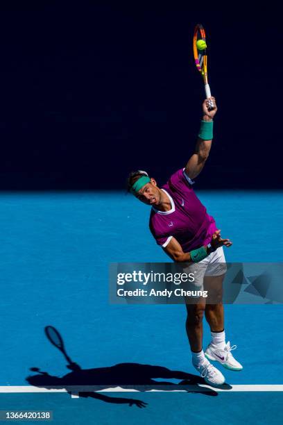 Rafael Nadal of Spain serves in his fourth round singles match against Adrian Mannarino of France during day seven of the 2022 Australian Open at...