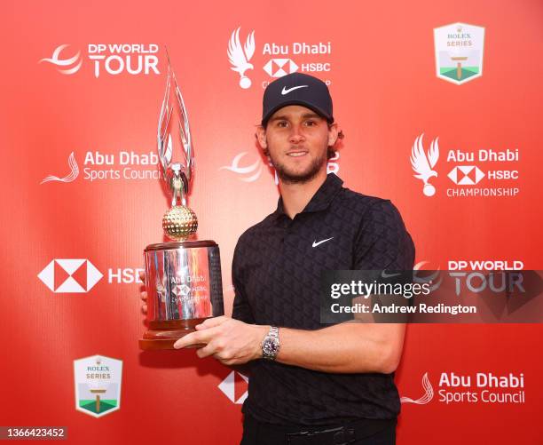 Championship winner Thomas Pieters of Belgium poses with the trophy as he celebrates after winning the Final Round of the Abu Dhabi HSBC Championship...