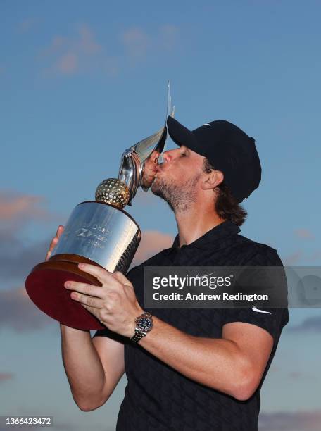 Championship winner Thomas Pieters of Belgium kisses the trophy as he celebrates after winning the Final Round of the Abu Dhabi HSBC Championship at...