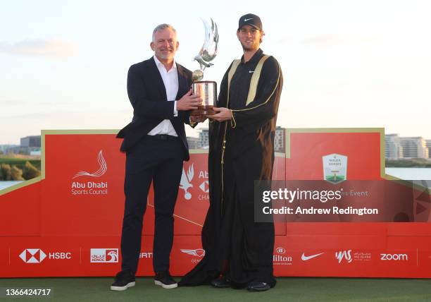 Championship winner Thomas Pieters of Belgium poses with the trophy as he celebrates after winning the Final Round of the Abu Dhabi HSBC Championship...