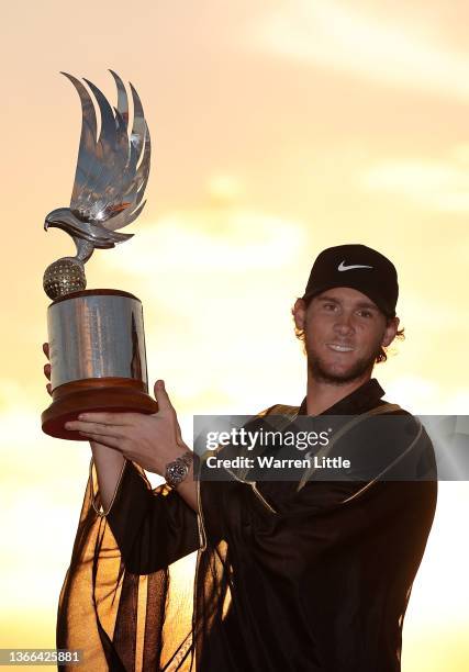 Thomas Pieters of Belgium poses with the trophy after winning the Abu Dhabi HSBC Championship at Yas Links Golf Course on January 23, 2022 in Abu...