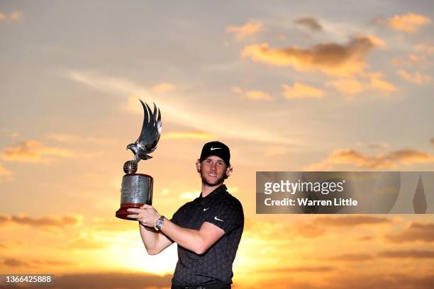 Thomas Pieters of Belgium poses with the trophy after winning the Abu Dhabi HSBC Championship at Yas Links Golf Course on January 23, 2022 in Abu...