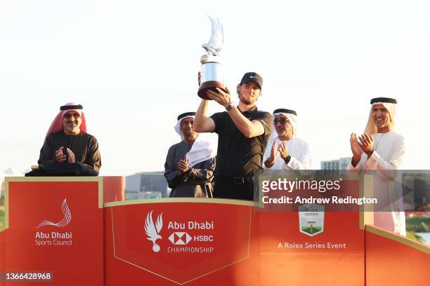 Championship winner Thomas Pieters of Belgium poses with the trophy as he celebrates after winning the Final Round of the Abu Dhabi HSBC Championship...