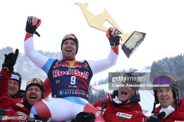 Beat Feuz of Switzerland celebrates winning the Audi FIS Alpine Ski World Cup Men's Downhill Hahnenkamm Rennen at Streif at the medal ceremony on...