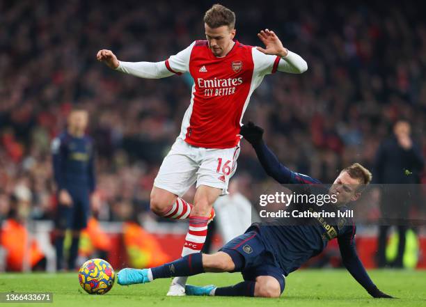 Rob Holding of Arsenal is challenged by Matej Vydra of Burnley during the Premier League match between Arsenal and Burnley at Emirates Stadium on...
