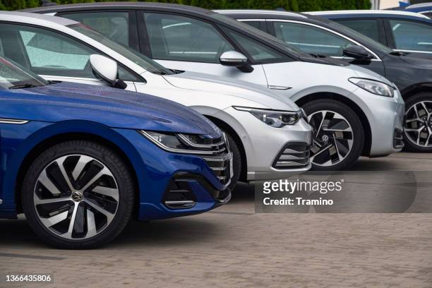 volkswagen cars on a parking - vehicle manufacturers brand names stock pictures, royalty-free photos & images