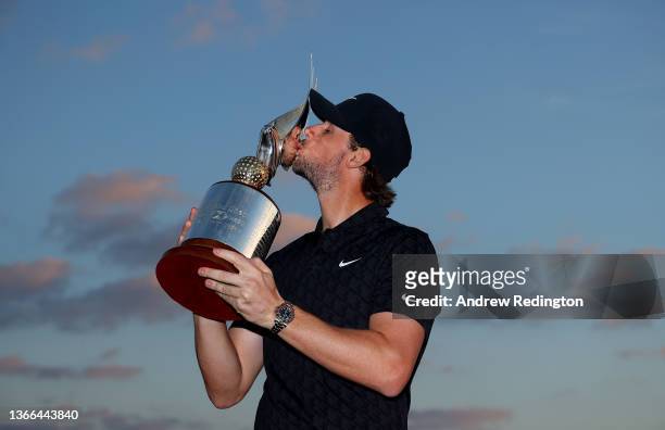 Thomas Pieters of Belgium poses with the trophy after winning the Abu Dhabi HSBC Championship at Yas Links Golf Course on January 23, 2022 in Abu...