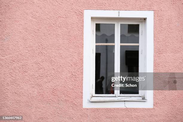 window in a pink house wall - window frame stock pictures, royalty-free photos & images