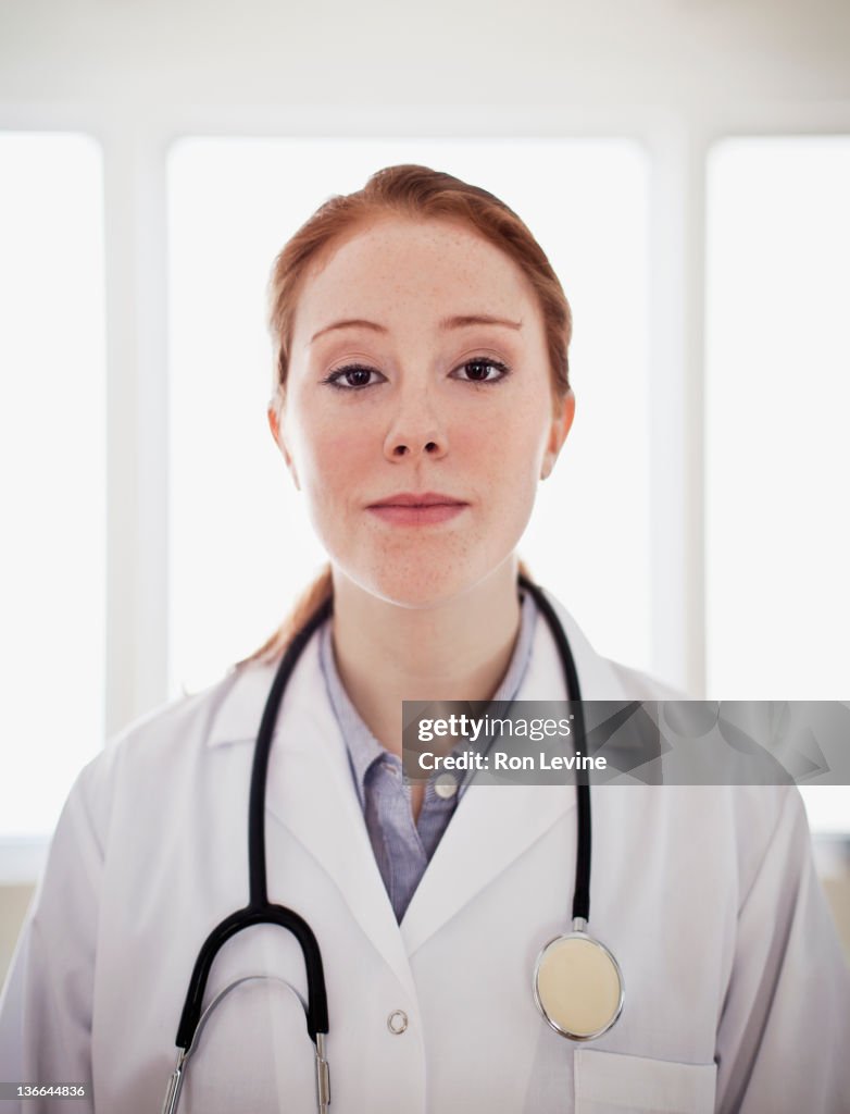 Young doctor, portrait in lab coat