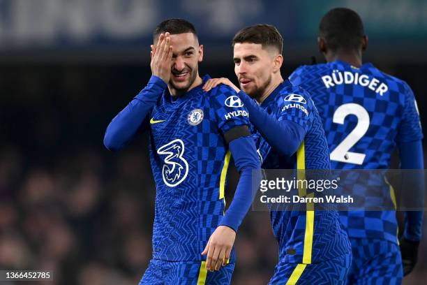 Hakim Ziyech of Chelsea celebrates with teammate Jorginho after scoring their team's first goal during the Premier League match between Chelsea and...