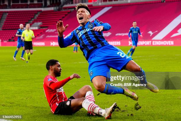 Lisandro Martinez of Ajax, Phillip Mwene of PSV Eindhoven during the Dutch Eredivisie match between PSV Eindhoven and Ajax at Philips Stadion on...