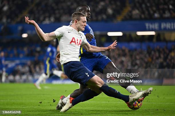 Oliver Skipp of Tottenham Hotspur is challenged by Malang Sarr of Chelsea during the Premier League match between Chelsea and Tottenham Hotspur at...