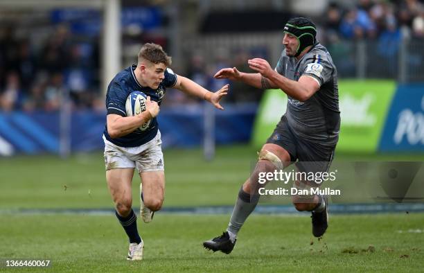 Garry Ringrose of Leinster makes a break past Will Spencer of Bath during the Heineken Champions Cup match between Bath Rugby and Leinster Rugby at...