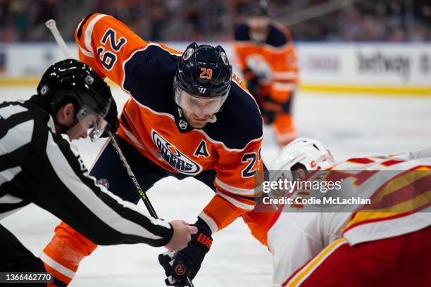 Leon Draisaitl of the Edmonton Oilers faces off against Brad Richardson of the Calgary Flames during the second period at Rogers Place on January 22,...