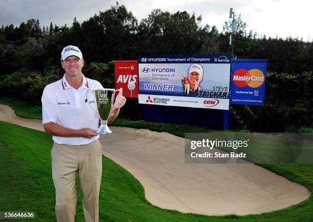 Steve Stricker holds the champions trophy after winning the final round of the Hyundai Tournament of Champions at Plantation Course at Kapalua on...