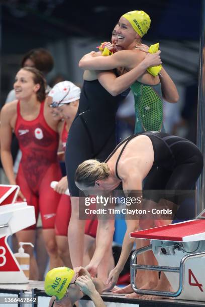 Bronte Campbell of Australia congratulates her sister Cate Campbell of Australia watched by team mates Meg Harris and Emma Mckeon after the...