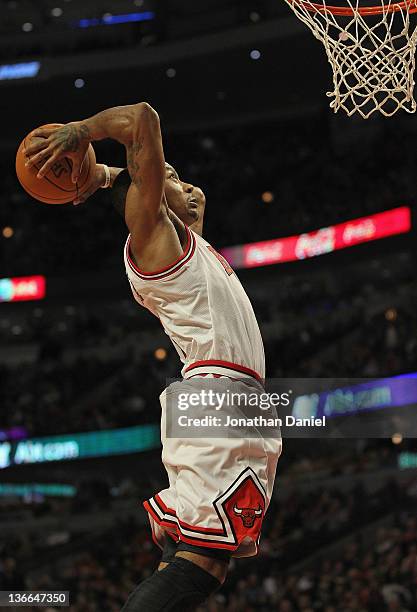 Derrick Rose of the Chicago Bulls goes up for a dunk against the Detroit Pistons at the United Center on January 9, 2012 in Chicago, Illinois. The...