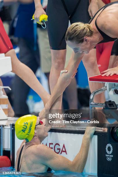 Bronte Campbell of Australia congratulates her sister Cate Campbell of Australia watched by team mates Meg Harris and Emma Mckeon after the...