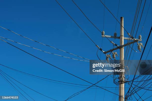 electricity pole and optical fiber cabling - high fibre stock pictures, royalty-free photos & images