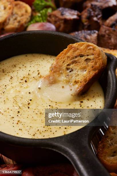 cheese fondue with toasted crostini - crostini stock pictures, royalty-free photos & images