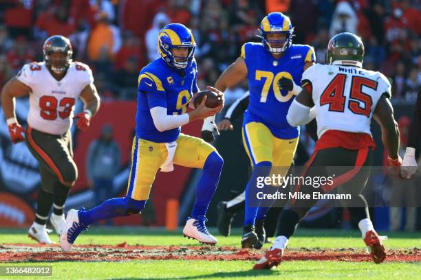 Matthew Stafford of the Los Angeles Rams runs with the ball in the second quarter of the game against the Tampa Bay Buccaneers in the NFC Divisional...