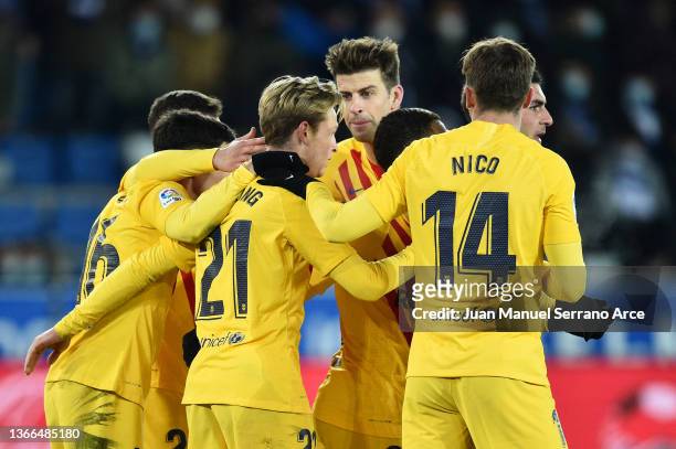 Frenkie de Jong of FC Barcelona celebrates after scoring their side's first goal with team mates during the LaLiga Santander match between Deportivo...