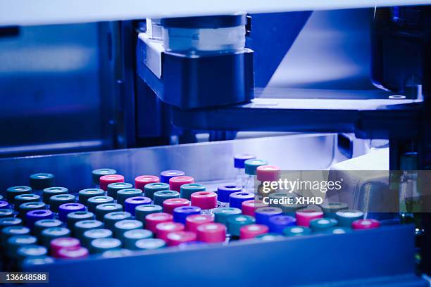 laboratory equipment robot arm working - pharmaceutical manufacturing machine stock pictures, royalty-free photos & images