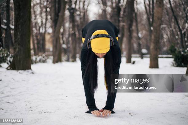 girl exercise in the winter spirit. - legging stock pictures, royalty-free photos & images