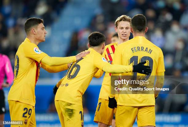 Frenkie De Jong of FC Barcelona celebrates with team mates after scoring his team's first goal during the LaLiga Santander match between Deportivo...