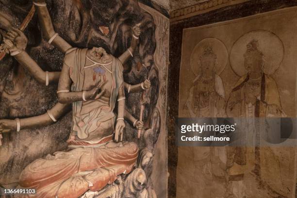 ancient frescoes in the buddhist caves of the mogao grottoes in dunhuang, china - mogao caves stock pictures, royalty-free photos & images