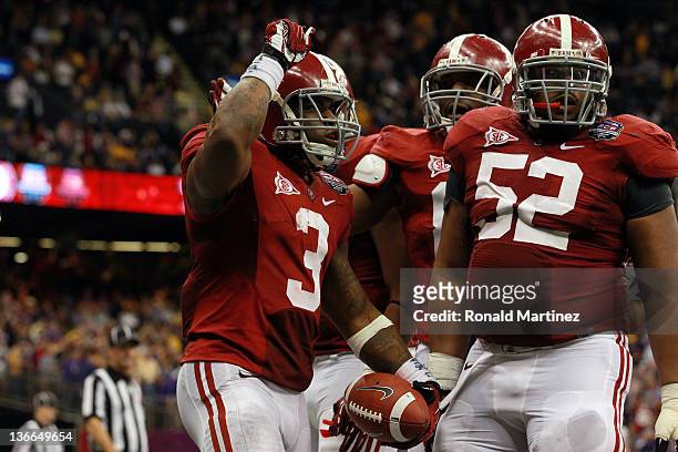 Trent Richardson of the Alabama Crimson Tide celebrates with Alfred McCullough after scoring a touchdown in the fourth quarter against the Louisiana...